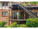 Charming brick exterior with black metal stairs and balcony, showcasing a well-maintained building facade at 1177 Church St # A, Decatur, GA 30030