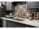 Bright kitchen featuring stainless steel appliances, tile backsplash, and granite countertops at 1177 Church St # A, Decatur, GA 30030