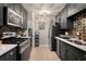 Modern kitchen featuring stainless steel appliances, granite countertops, and contemporary backsplash at 1177 Church St # A, Decatur, GA 30030