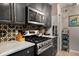 Modern kitchen featuring stainless steel appliances, granite countertops, and a gas range at 1177 Church St # A, Decatur, GA 30030