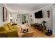 Bright living room featuring hardwood floors, a comfortable couch, and a flat-screen TV at 1177 Church St # A, Decatur, GA 30030