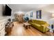 Spacious living room featuring hardwood floors, a comfortable couch, and access to the dining area at 1177 Church St # A, Decatur, GA 30030