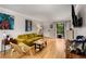Bright living room with hardwood floors, a comfortable couch, and sliding glass doors to the balcony at 1177 Church St # A, Decatur, GA 30030