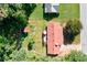 An aerial view of the home showcasing the backyard, patio, and surrounding greenery at 1420 Hillside Se Pl, Conyers, GA 30094