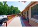 Large back deck showcasing outdoor furniture, a grill, and a view of the surrounding trees at 1420 Hillside Se Pl, Conyers, GA 30094