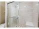 Bathroom featuring a modern shower with tile and seating at 1420 Hillside Se Pl, Conyers, GA 30094