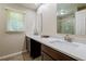 Bathroom featuring dual sinks and a large mirror at 1420 Hillside Se Pl, Conyers, GA 30094