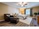 Comfortable bedroom with a ceiling fan, large window, and stylish furniture at 1420 Hillside Se Pl, Conyers, GA 30094