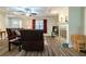 Cozy living room featuring a fireplace, hardwood floors, and lots of natural light at 1420 Hillside Se Pl, Conyers, GA 30094