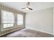 Bedroom with neutral-toned walls, carpet, and ceiling fan at 2564 Riggs Dr, East Point, GA 30344