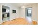 Open dining area with hardwood floors connects seamlessly to the kitchen and other living spaces at 2564 Riggs Dr, East Point, GA 30344