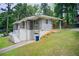 Two-story home with brick accent and landscaped lawn at 2564 Riggs Dr, East Point, GA 30344