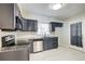 Well-lit kitchen features granite counters, stainless steel appliances, and painted cabinets at 2564 Riggs Dr, East Point, GA 30344