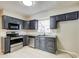 Functional kitchen featuring granite countertops, stainless appliances, and ample cabinet space at 2564 Riggs Dr, East Point, GA 30344