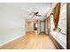 Bright living room featuring natural light, hardwood floors, a ceiling fan, and fresh paint at 2564 Riggs Dr, East Point, GA 30344