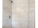 The tile shower is bright, and features a chrome shower head and controls at 2564 Riggs Dr, East Point, GA 30344