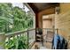 Relaxing balcony with comfortable seating and a lush green view perfect for outdoor enjoyment at 3500 Sweetwater Rd # 522, Duluth, GA 30096