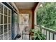 Cozy balcony featuring a chair and greenery, offering a tranquil outdoor space at 3500 Sweetwater Rd # 522, Duluth, GA 30096