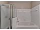 Clean bathroom with a shower and soaking tub at 3500 Sweetwater Rd # 522, Duluth, GA 30096