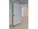 A bright bedroom featuring a large door with neutral walls and floors at 3500 Sweetwater Rd # 522, Duluth, GA 30096