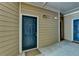 Condo front door with number 522, sidelight, welcome mat, and tan siding at 3500 Sweetwater Rd # 522, Duluth, GA 30096