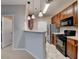 Bright kitchen with breakfast bar, stainless appliances, and wooden cabinets at 3500 Sweetwater Rd # 522, Duluth, GA 30096