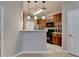 Open kitchen with breakfast bar, stainless appliances, and ample storage space at 3500 Sweetwater Rd # 522, Duluth, GA 30096
