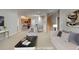 Staged living room featuring kitchen and dining area in the background at 3500 Sweetwater Rd # 522, Duluth, GA 30096