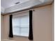 Cozy bedroom bathed in natural light, with dark curtains creating a serene atmosphere at 3500 Sweetwater Rd # 522, Duluth, GA 30096