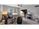 Bedroom featuring ceiling fan, carpet floors, and natural light from the window at 4012 Ironhill Ln, Woodstock, GA 30189