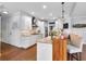 Kitchen featuring white cabinets, a center island, and stainless steel appliances at 4012 Ironhill Ln, Woodstock, GA 30189