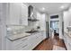 Kitchen featuring white cabinetry, stainless appliances, and granite countertops at 4012 Ironhill Ln, Woodstock, GA 30189