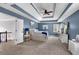 Large main bedroom with sitting area, beautiful trey ceiling, and ensuite bath at 4012 Ironhill Ln, Woodstock, GA 30189