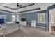 Large main bedroom with sitting area, beautiful trey ceiling, and ensuite bath at 4012 Ironhill Ln, Woodstock, GA 30189