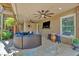 Cozy covered patio with outdoor seating, ceiling fan, and access to backyard at 4012 Ironhill Ln, Woodstock, GA 30189