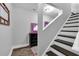 This modern staircase features hardwood steps with freshly painted white risers and baseboards, adding to this home's charm at 4012 Ironhill Ln, Woodstock, GA 30189