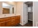 Bathroom with double sink vanity, modern fixtures, and a view into the main bedroom at 592 Cricket Hill Trl, Lawrenceville, GA 30044