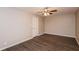Bedroom featuring wood-look floors, neutral walls, ceiling fan, and plenty of natural light at 592 Cricket Hill Trl, Lawrenceville, GA 30044