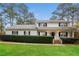 Charming home with a well-maintained lawn, mature trees, and welcoming front porch at 592 Cricket Hill Trl, Lawrenceville, GA 30044