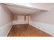 Living room with wainscotting, stylish floors, neutral paint, and lots of light at 592 Cricket Hill Trl, Lawrenceville, GA 30044