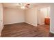 Main bedroom features stylish floors, ceiling fan, and ensuite bathroom at 592 Cricket Hill Trl, Lawrenceville, GA 30044