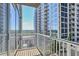 Enjoy stunning city views from this condo balcony with glass windows and modern railing at 855 Peachtree Ne St # 1311, Atlanta, GA 30308
