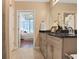 Bright bathroom connects to bedroom with double vanity, and neutral accents creating an inviting atmosphere at 855 Peachtree Ne St # 1311, Atlanta, GA 30308