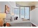 Bright bedroom with expansive windows, hardwood floors, and a sleek, modern design at 855 Peachtree Ne St # 1311, Atlanta, GA 30308