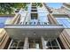 Contemporary building entrance features a modern design and prominent signage at 855 Peachtree Ne St # 1311, Atlanta, GA 30308