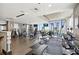 Community gym featuring modern exercise equipment and expansive windows with city views at 855 Peachtree Ne St # 1311, Atlanta, GA 30308