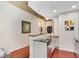 Open kitchen area featuring a breakfast bar and stainless steel dishwasher and sink at 855 Peachtree Ne St # 1311, Atlanta, GA 30308