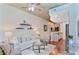 Bright living area with modern decor, hardwood floors, and open kitchen access at 855 Peachtree Ne St # 1311, Atlanta, GA 30308
