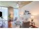 Bright living room with large windows, modern decor, and comfortable seating at 855 Peachtree Ne St # 1311, Atlanta, GA 30308