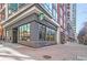 Street view of a corner Starbucks with outdoor pedestrian area in mixed use real estate at 855 Peachtree Ne St # 1311, Atlanta, GA 30308